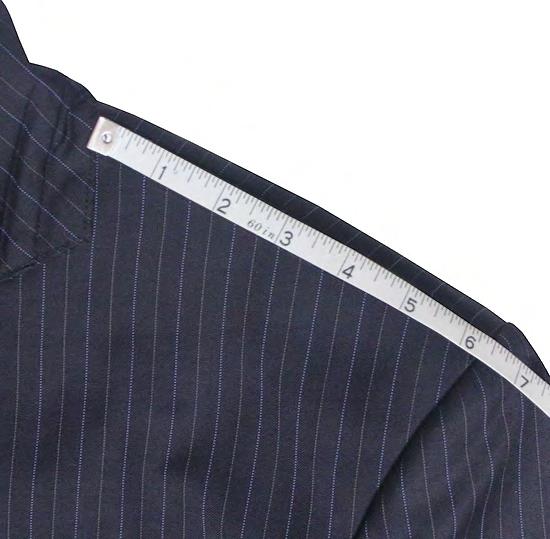 SHOULDER Measure the distance between sleeve and collar