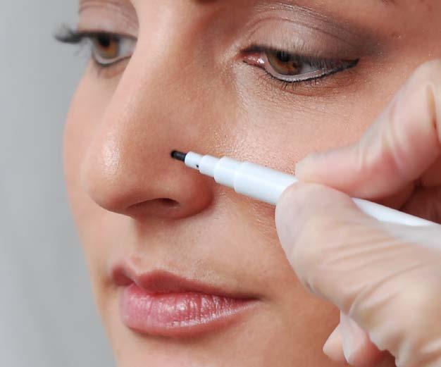 Using the Medisept marking pen, gently mark the spot where the piercing will take place.