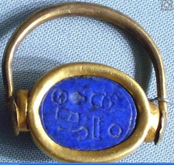 13 (b) except the bezel is a plain elliptical surface with hieroglyphic inscriptions on its surface. It is manufactured from gold and lapis lazuli (the bezel). Fig.