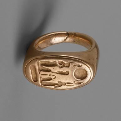 ring located in the Metropolitan Museum of Art and shown in Fig.17 (a) [30]. It is manufactured from gold, has an elliptic bezel, wide and thick hoop and deep inscriptions on the bezel top.