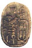 Scarab with the name of Tiye, wife of Amenhotep III, in a cartouche along with the epithet "Great Royal Wife, May