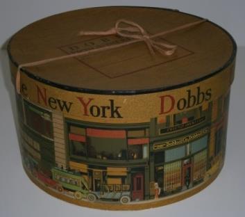 "Dobbs" Woman's gold round cardboard with