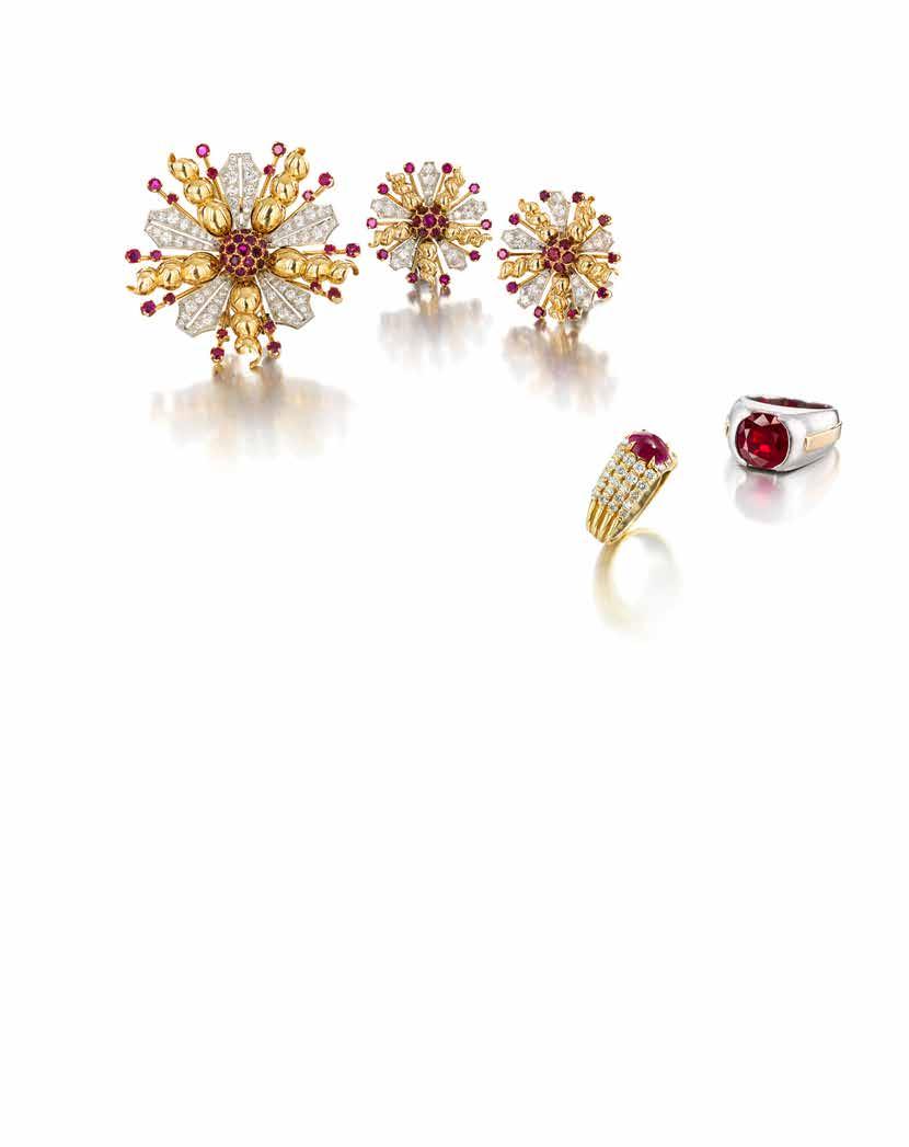 47 48 49 47 A DIAMOND AND RUBY BROOCH AND EARRING SUITE designed as a stylized floral motif, centrallyset with round brilliant-cut rubies, set throughout with old European and single-cut diamonds,