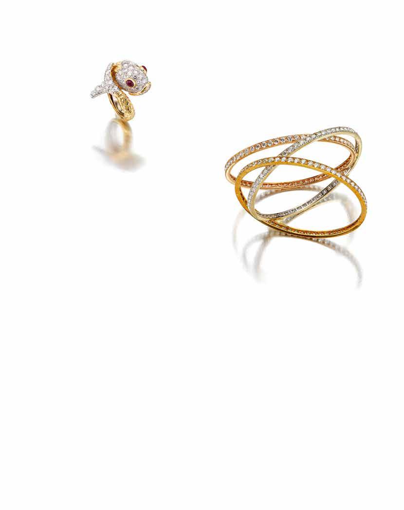 63 64 PROPERTY FROM A CALIFORNIA ESTATE 63 A DIAMOND AND RUBY FISH RING, DAVID WEBB the coiling fish of textured gold, the head and tail adorned with pavéset round brilliant-cut diamonds, set with
