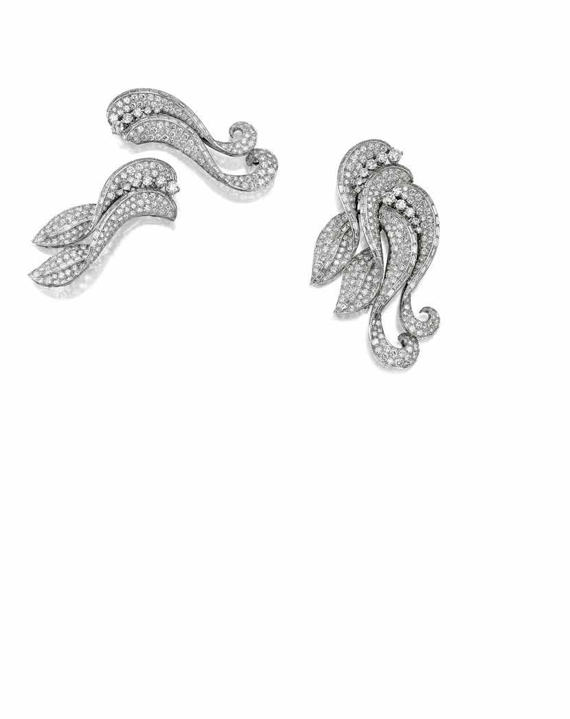 119 (alternative view) PROPERTY FROM A PRIVATE COLLECTION 119 A DIAMOND DOUBLE CLIP BROOCH each of scrolling foliate design, comprised of round brilliant-cut diamonds, accented by baguette-cut
