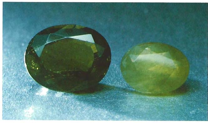 Figure 7. These 1.27-ct (left) and 0.75-i ;I (right) elzanites are reportedly from Sri Lanlza. Note the haziness of these metamict gemstones.