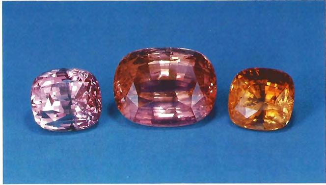 Figure 24. The cr; shown in figure 23 yielded these 23.55-ct, 47.00-ct, and 16.92-ct cut stones. The stone on the far right has been heat treated. Figure 23.