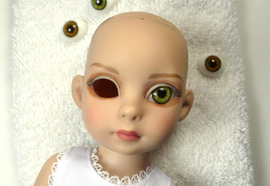 11 Now the fun part! Try some eyes out. The vinyl eye cups inside Patsy s head will hold the eyes, so you don t need glue.