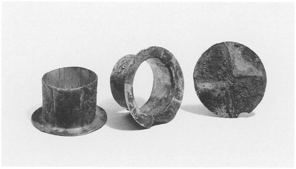 Figure 35. Pair of earflares, Moche, Peru. Silver and gold, Diam. of shafts 5.2-5.3 cm.