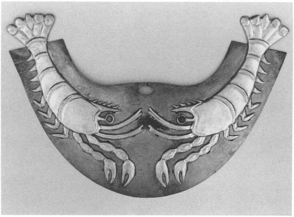 Figure 7. Nose ornament, Moche, from Loma Negra, Peru. Silver and gold, W. 18.7 cm. The ornament overall is silver sheet; the applied crayfish are gold. The Metropolitan Museum of Art, The Michael C.