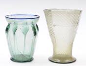 A Tiffany soda glass beaker vase of oviform with flaring rim the body with vertical trailed ribbed decoration the rim with single blue trail,