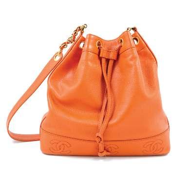 68 A Chanel Mandarin Caviar Leather Drawstring Bucket Bag, with goldtone hardware, an embossed logo motif and an