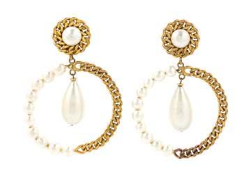 25. $300-500 90 91 A Pair of Chanel Faux Pearl and Goldtone Hoop Earclips, 1970s,
