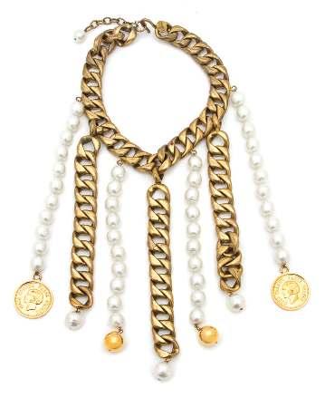 7.5. $2,000-3,000 101 A Chanel Goldtone Double Strand Monocle Necklace, 1985, with faux pearl and black bead detail and a monocle pendant with rhinestone embellishment.