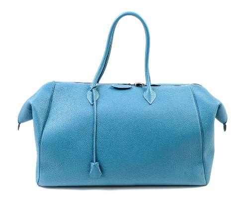 14 14 An Hermès Sky Blue Taurillon Clemence 50cm Paris Bombay Travel Bag, 2009, with palladium hardware, dual rolled handles, a top zip closure, a toile lining, a clochette with lock and keys and
