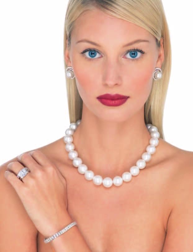 24 A single strand South Sea cultured pearl necklace. Composed of 31 graduated cultured pearls measuring from 12 to 13.7mm, completed by an 18K white gold safety clasp, Length 16 inches. $18,000.