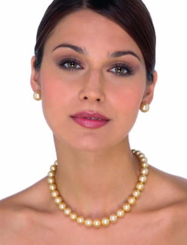 32 A pair of golden cultured pearl earrings. Each composed of a single natural color golden Indonesian South Sea cultured pearl measuring 12mm, mounted in 18K yellow gold. $4,500.