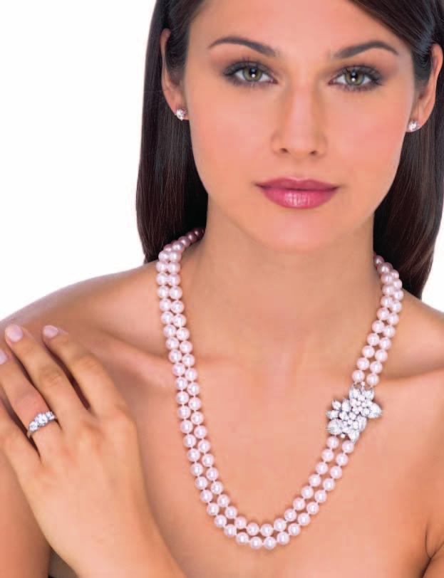 4 A double strand cultured pearl and diamond necklace. Composed of two strands of 8 x 8.