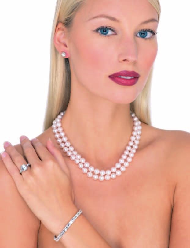 6 A double strand cultured pearl necklace. Composed of two strand of 8.5 to 9mm natural color Japanese Akoya cultured pearls of AA quality, completed with an 18K yellow gold two-row clasp.