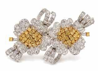 81 80 82 80 An 18 Karat Yellow Gold, Yellow Sapphire, Colored Diamond and Diamond Ring, N. Varney, in a pave set bezel setting, containing one yellow sapphire weighing approximately 13.