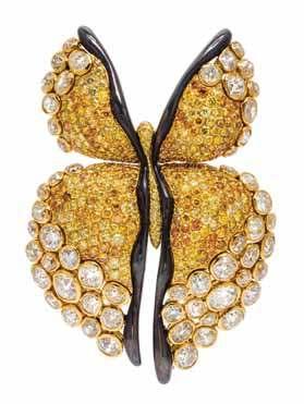 148 147 149 147 An 18 Karat Yellow Gold and Colored Diamond Ring, in a low dome pear shape design, containing numerous pave set round brilliant cut yellow diamonds (origin of color not tested)