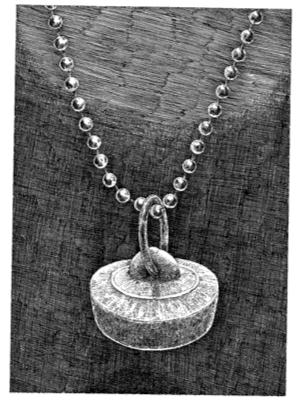 THE SACRED PENDANT This piece of jewelry was found lodged in a hole in the floor of the