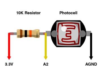To have the pupils contract or expand in response to light, connect a photocell and 10K resistor in series.