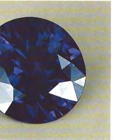 45-ct oval mixed cut displayed a change of color from dark blue in daylight to purplish blue in incandescent light (figure 19). The most remarkable was its absorption spectrum.