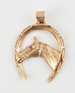 1135 14K yellow gold pendant in the shape of a man in the center of a