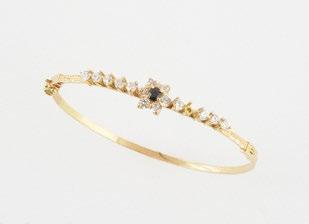 1167, SAPPHIRE AND 18K yellow gold bracelet set with a sapphire surrounded bu