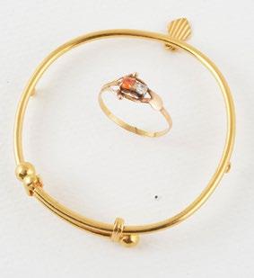 1000 14K yellow gold little bangle bracelet. Weight: 7.0g. Also included one gilded metal ring with two (2) little clear and orange stones.
