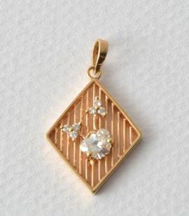 1004 AND 18K yellow gold pendant set with six (6) brilliantcut diamonds weighing approximately a total of 0.