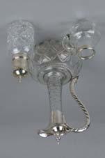 Lot 118 Lot 118 A LATE VICTORIAN CUT GLASS CLARET JUG, of shaft and globe form, plated mounts, rope twist effect handle and spiral twist band, height approximately 27.