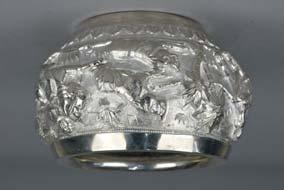 Lot 153 Lot 153 AN INDIAN WHITE METAL BOWL, chased with a hunting scene featuring men riding a horse and an elephant, with others
