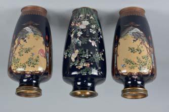 COVERS, cast with foliage and berries throughout, on ebonised wooden fluted column pedestals with shaped square plinth