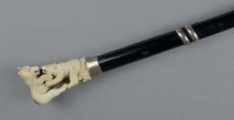 Wilde, approximate length 83cm 100-150 plus BP* Lot 258 A 19TH CENTURY EBONISED WALKING CANE, the carved