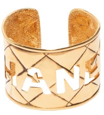 SZZ122F Cuff bracelet in gold-toned metal with quilted