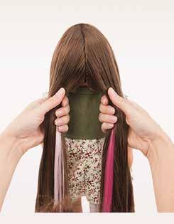 Clip on one hair extension to each half, hiding the felt pieces.