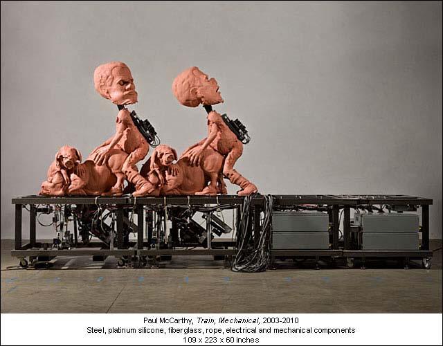 But the one sculpture that will raise your eyebrows to the ceiling and make your jaw drop to the floor is the soft pink silicone Mechanical Train depicting two male figures in perpetual movement,