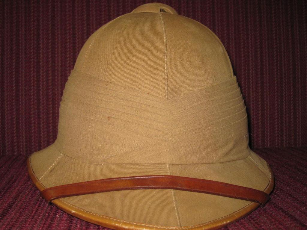 MCM770 HAT, HELMET, PITH Pith helmet with brown leather strap.