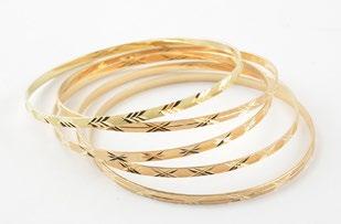 69 *Set of 5 10K yellow gold bangle bracelets. Weight: 23.9g.