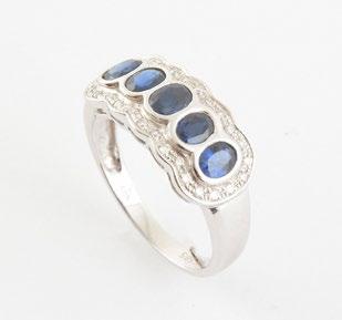 129, SAPPHIRES AND DIAMONDS 14K white gold ring set with 5 oval cut sapphires paved with