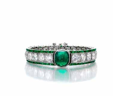 177 176 176 AN EMERALD AND DIAMOND RING centering a cut-cornered rectangular step-cut emerald, weighing approximately 6.