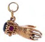 To include a 9ct gold ruby baby shoe charm, a 9ct gold diamond and red gem hand charm, together with a 9ct gold amethyst pendant and four further items. Four with hallmarks for 9ct gold.