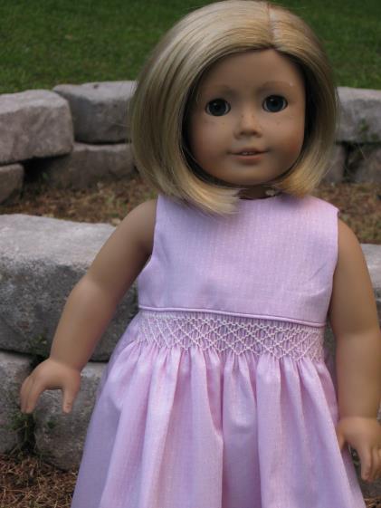 Annabelle looked very demure in a pink Swiss cotton sundress adorned with just a hint of smocking.