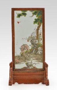 127 Enamelled ceramic table screen and base representing on one side a scene of characters and pavilions against a backdrop of lake and mountain landscape,