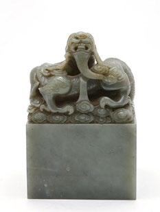 5 135 Large nephrite inscribed seal surmounted by a dragon and his little one.
