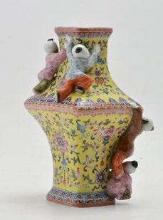 China 20th C. H: 24.5cm - 9.75 162 Glazed porcelain vase decorated with climbing children. China, 20th C.