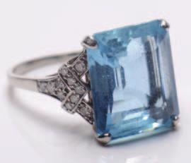 191 191. An aquamarine and diamond mounted ring with single rectangular aquamarine approximately 14.2mm long x 12.