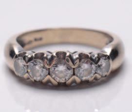 A diamond mounted five-stone ring with graduated circular brilliant-cut stones estimated to weigh a total of 1.